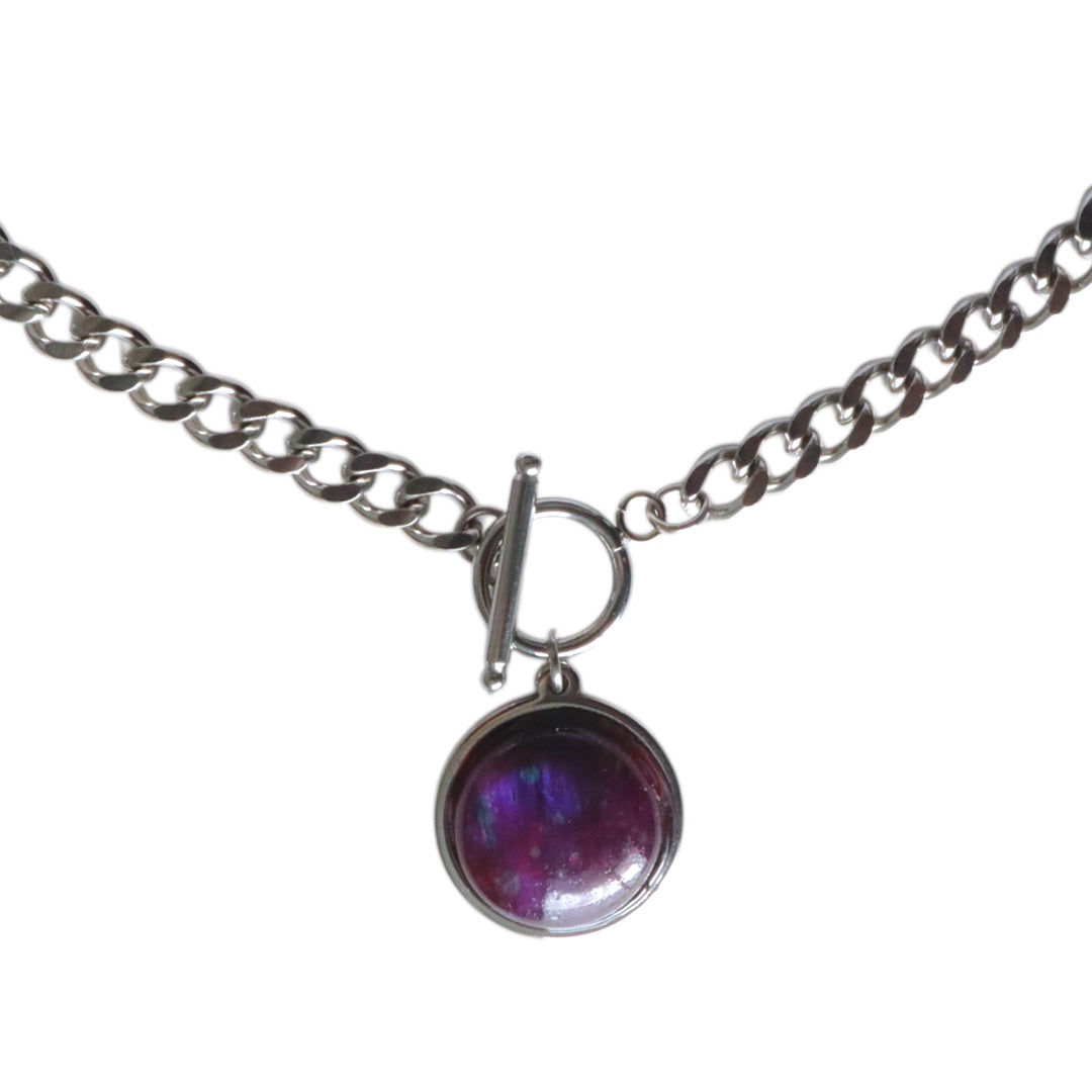 Necklace with a purple pendant on a white background
