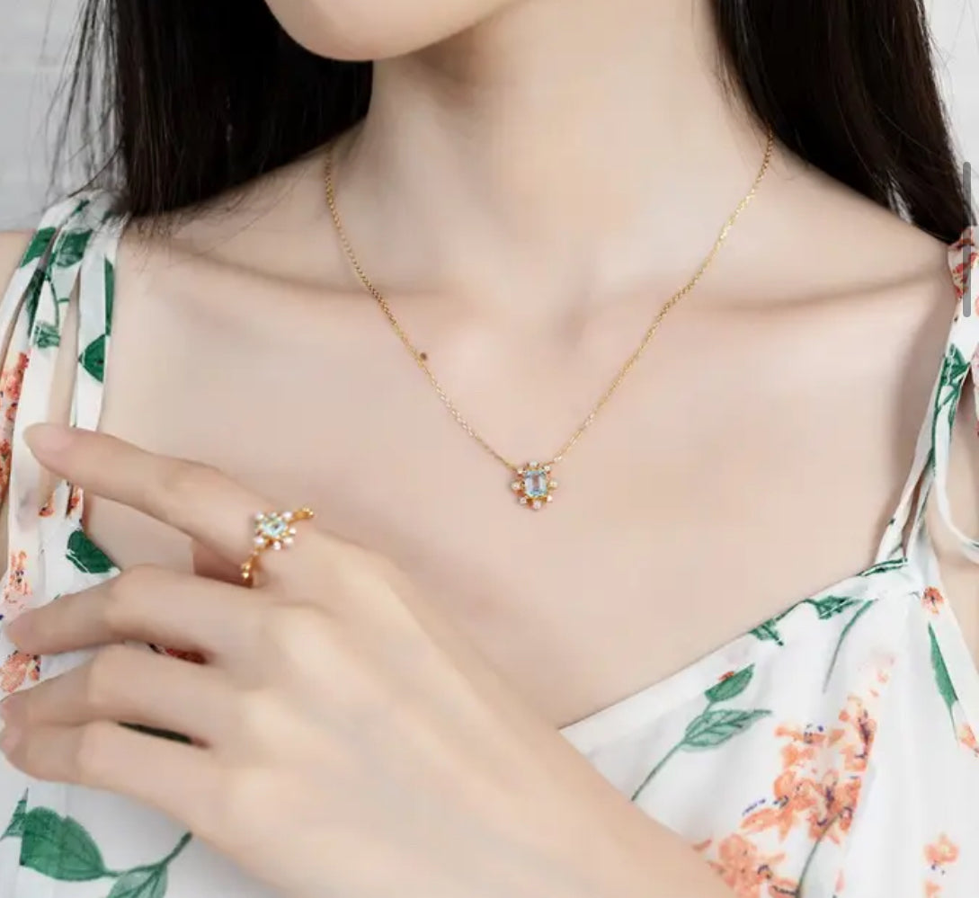 MOTI Blue Topaz and Pearl Ring - Gold