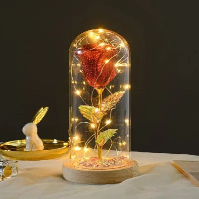 Rose éternelle dans une décoration lumineuse LED en verre