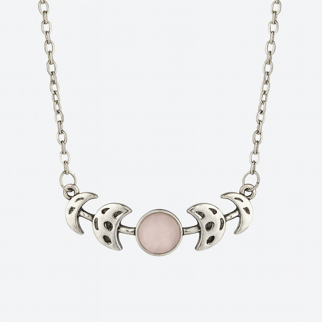 Necklace with silver moon phases and a pink center on a white background