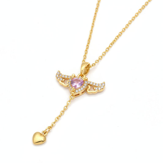Gold necklace with a pink heart pendant on a white background