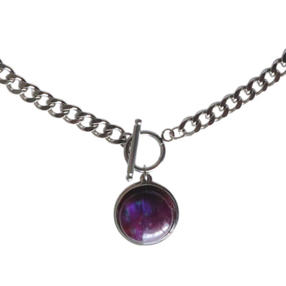 Necklace with a purple pendant on a white background