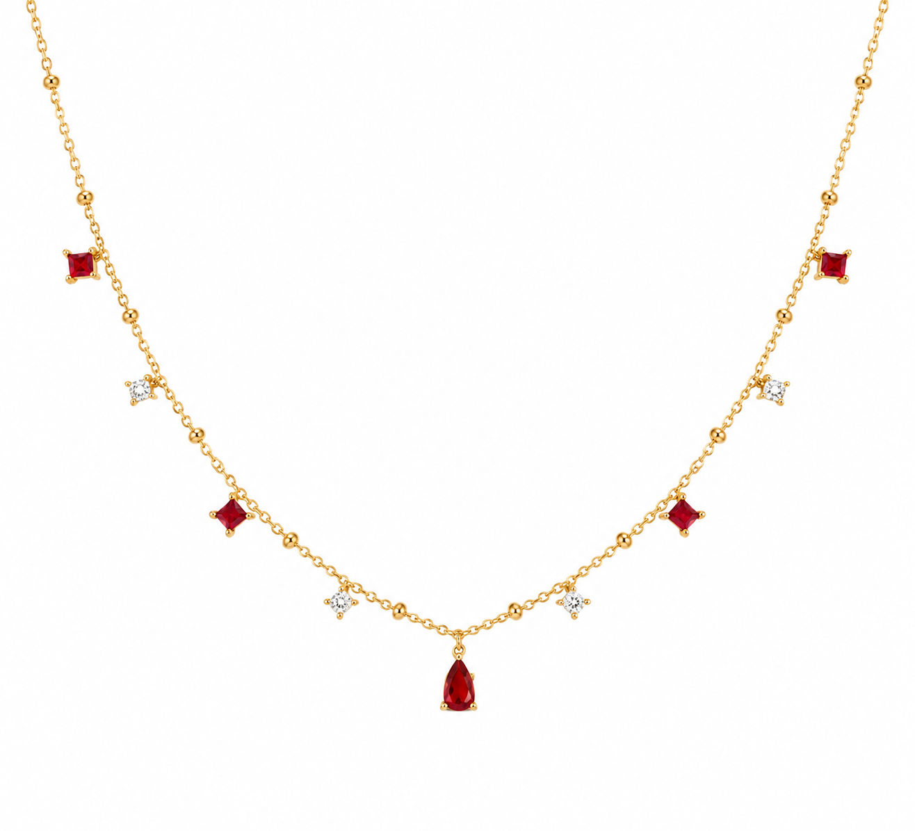 Gold necklace with red gemstones on a white background