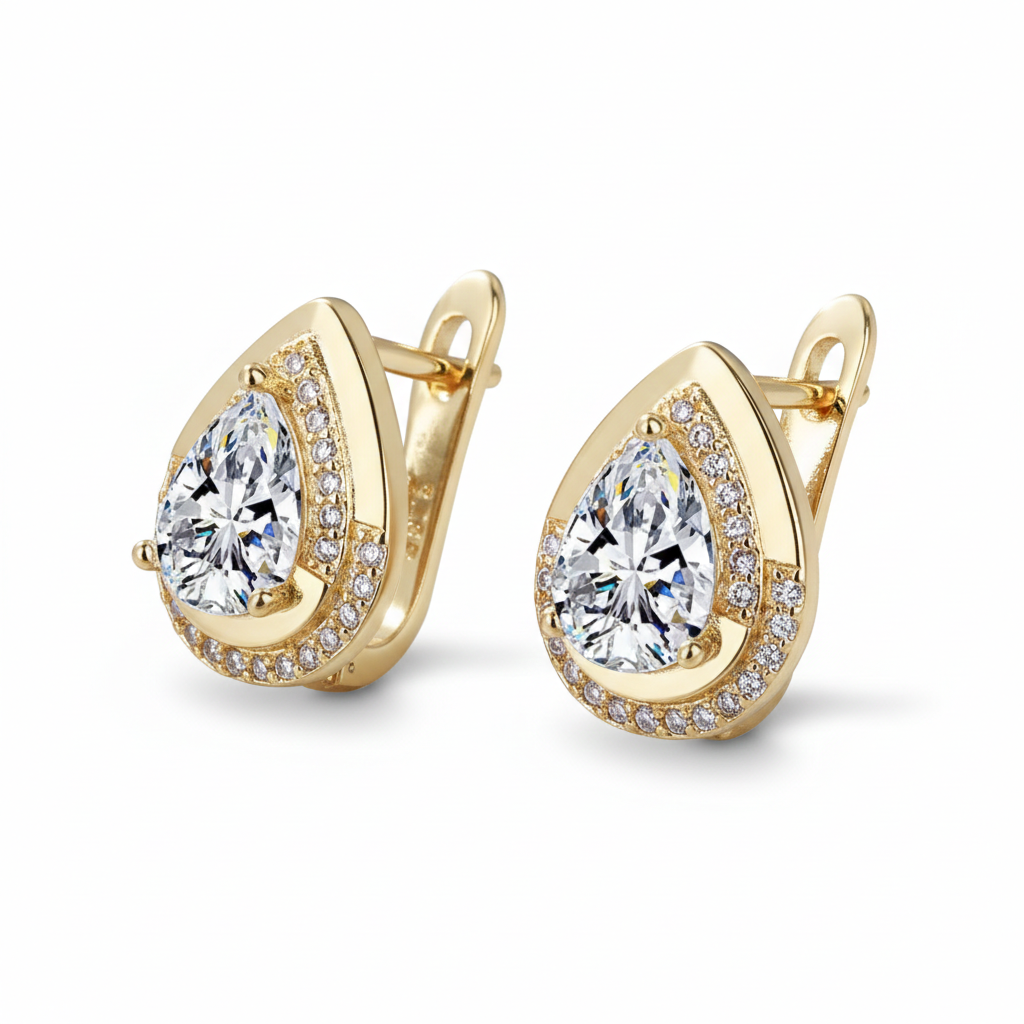 Gold earrings with clear gemstones on a white background