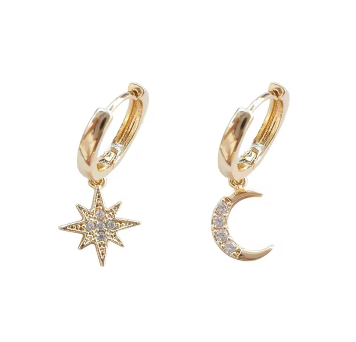 A pair of gold-plated earrings featuring one star and one crescent moon charm with zircon stone accents.