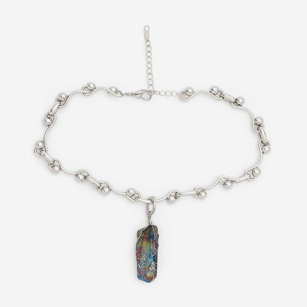 Silver chain necklace with a colorful stone pendant on a white background