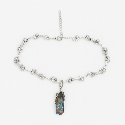 Silver chain necklace with a colorful stone pendant on a white background