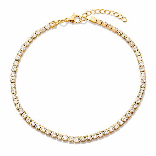 Gold bracelet with clear stones on a white background