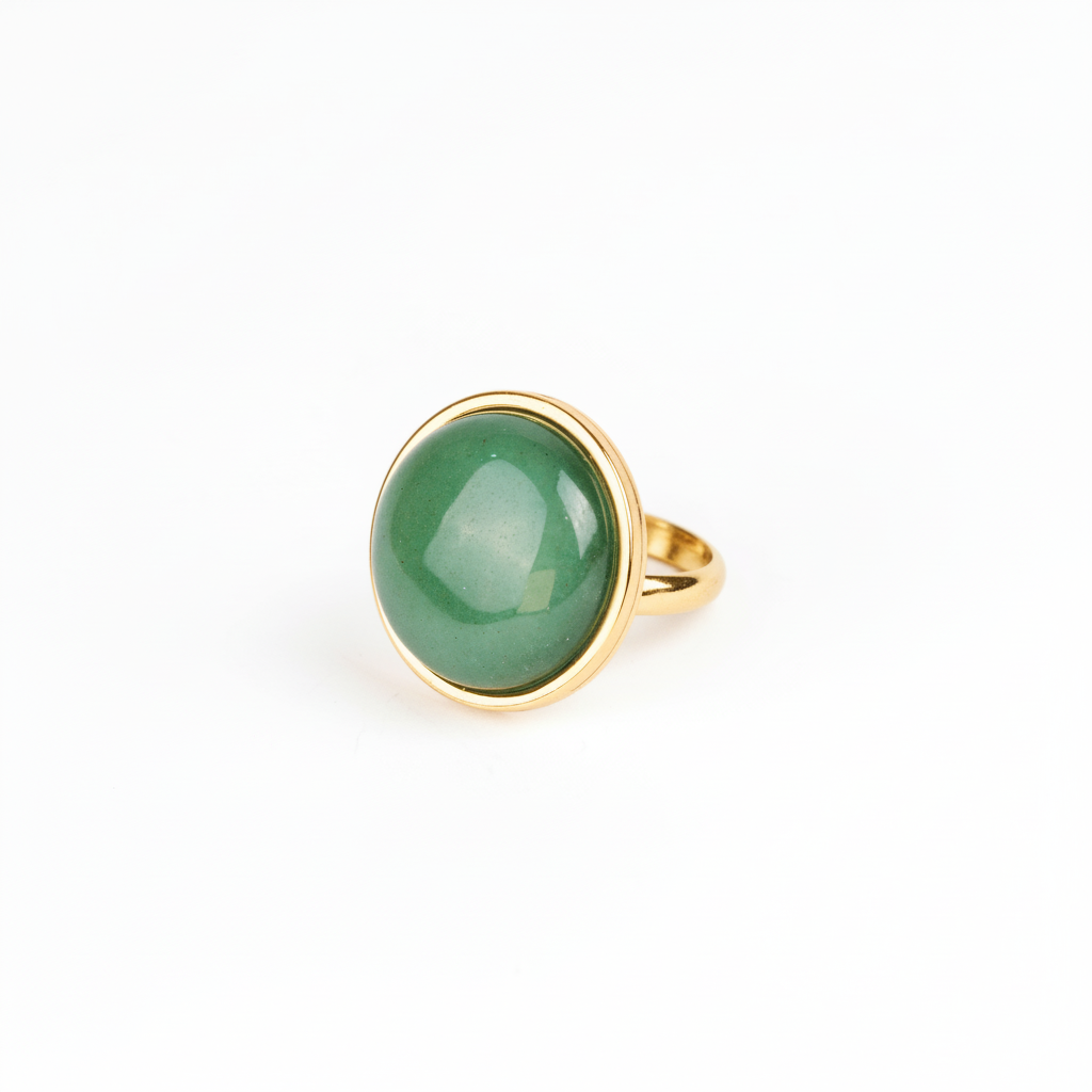 Gold ring with a green gemstone on a white background