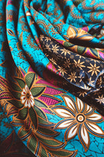 Load image into Gallery viewer, scarf silk, blue floral, silk shawl, bali sarong, bali silk, sarong wrap long, sarong skirt, long sarong wrap , luxury sarongs, sarong clothing, floral silk sarong, floral sarong, beach wrap, beach cover up, , beach sarong wrap, how to tie a sarong, 
